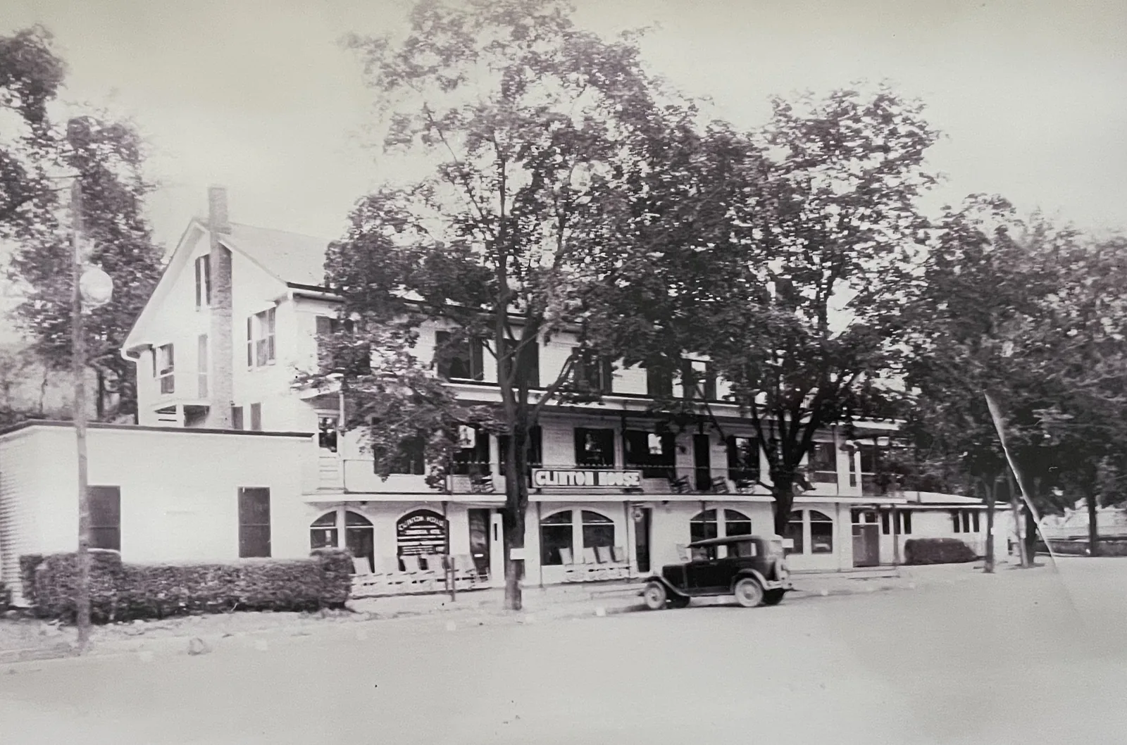 A car at the curb outside the Clinton House
