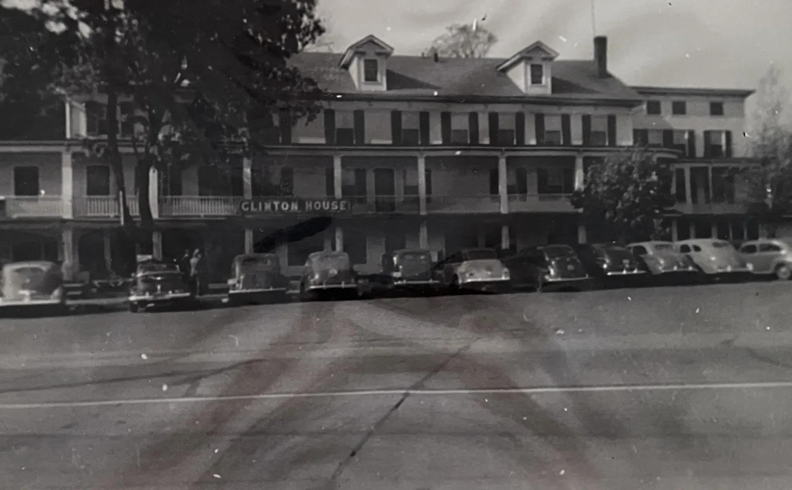 Cars parked along West Main Street outside the Clinton House