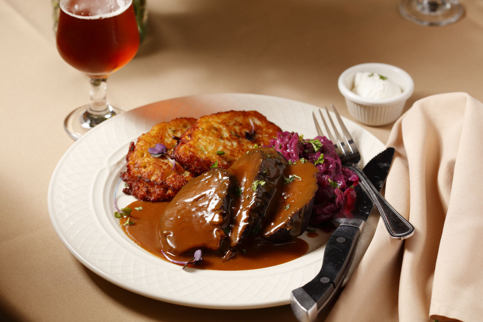 Sauerbraten with potato pancake and red cabbage