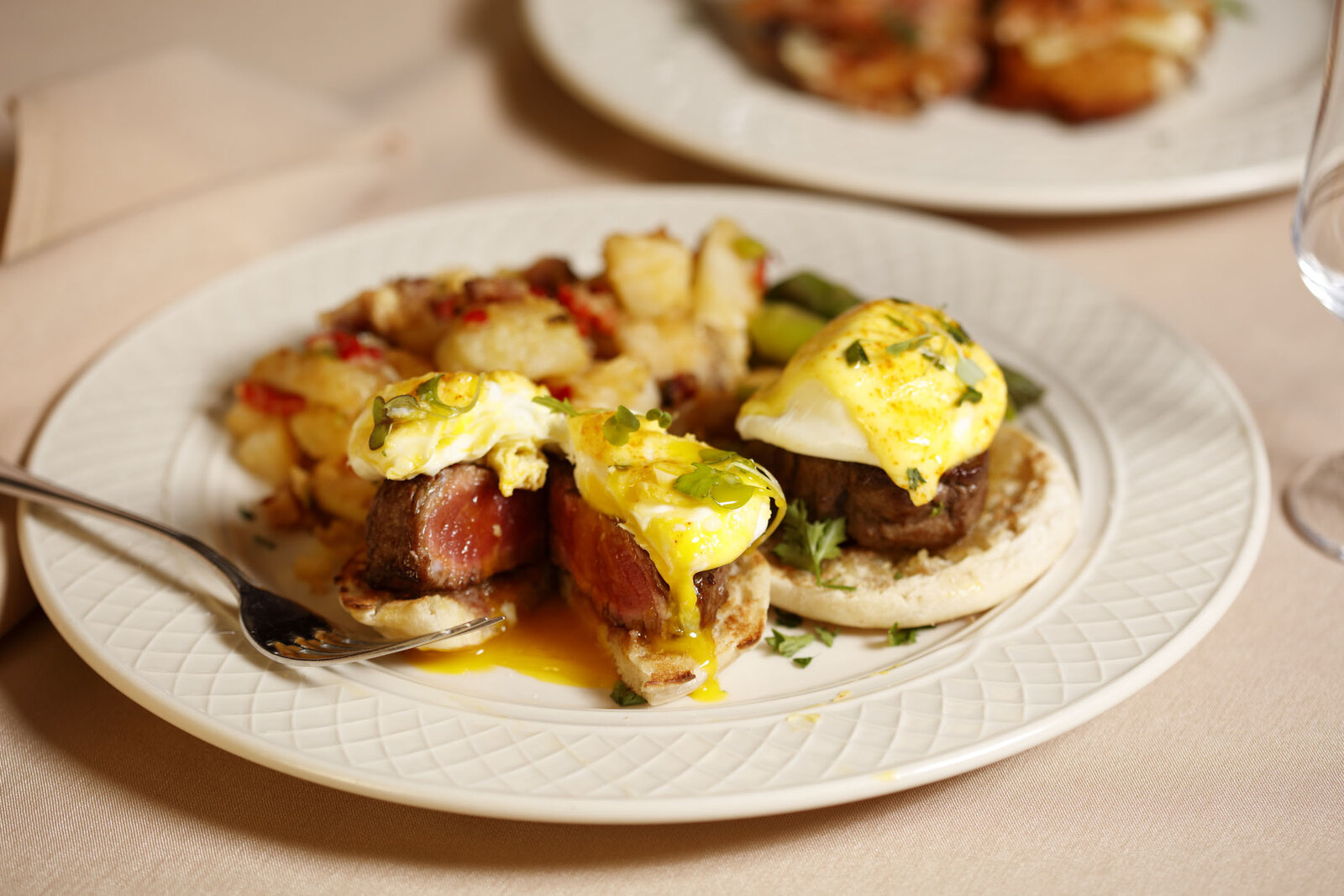 Steak benedict with potatoes and asparagus
